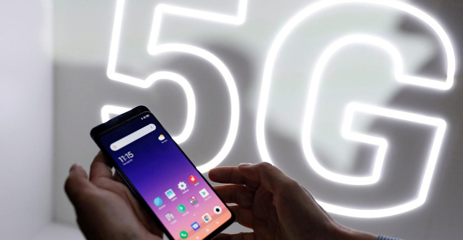 A person checks out the new Xiaomi Mi 9 mobile phone